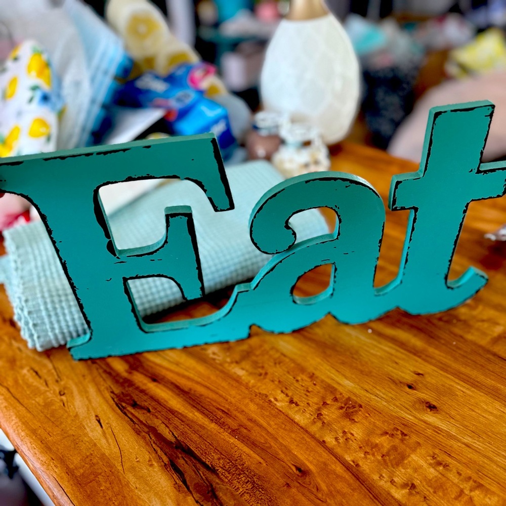Wood “EAT” sign decor